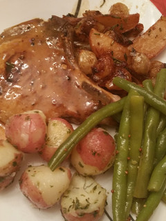 A picture of Pork Chops Apples and Onions.