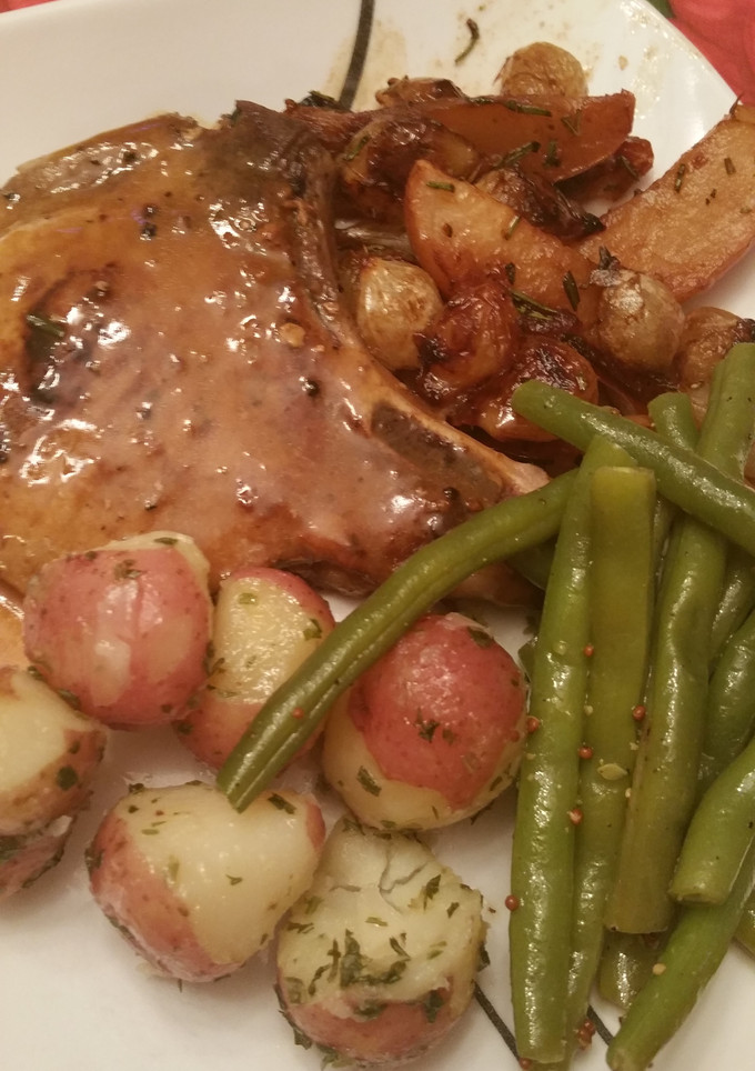 A picture of Pork Chops Apples and Onions.