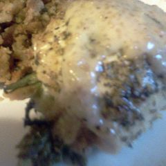 A picture of asparagus stuffed lemon chicken.