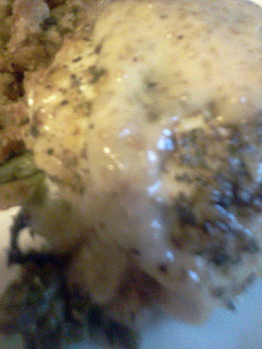 A picture of asparagus stuffed lemon chicken.