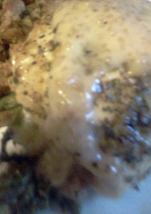 A picture of asparagus stuffed lemon chicken.