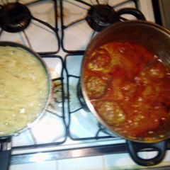 A picture of meatball and spaghetti.
