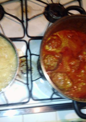 A picture of meatball and spaghetti.