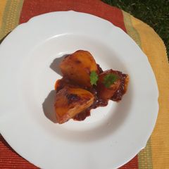 A picture of Two halves baked potato in sauce #RamadhanContest.