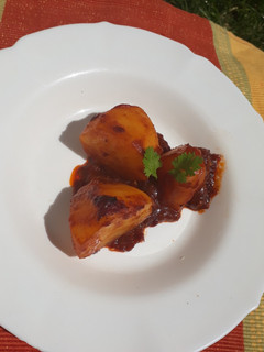 A picture of Two halves baked potato in sauce #RamadhanContest.