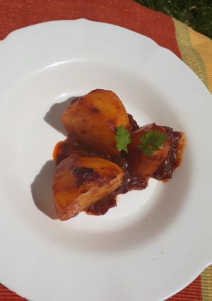 A picture of Two halves baked potato in sauce #RamadhanContest.