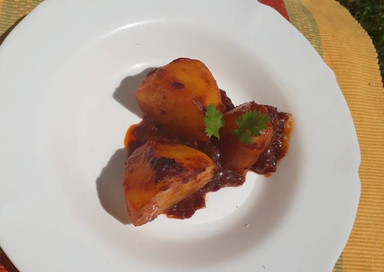 Two halves baked potato in sauce #RamadhanContest