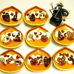 A picture of Kabocha Squash Custard Puddings Decorated with Chocolate Characters for Halloween.