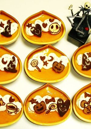 A picture of Kabocha Squash Custard Puddings Decorated with Chocolate Characters for Halloween.
