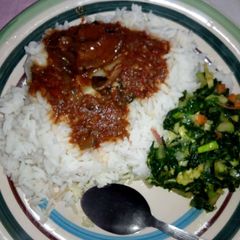 A picture of Rice and stew with vegetable.