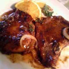 A picture of orange-glazed pork chops.