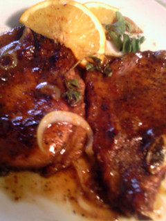 A picture of orange-glazed pork chops.