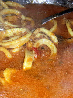 A picture of Calamari in Tomato Sauce.