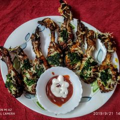 A picture of Baked chicken drumsticks.