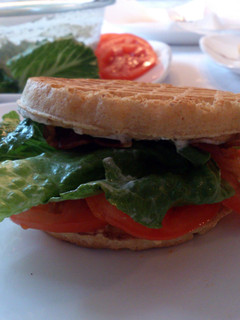 A picture of Waffle BLT's with a tangy herb sauce.