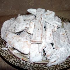 A picture of Polish chrusciki/ fried dough dessert.