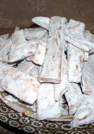 A picture of Polish chrusciki/ fried dough dessert.