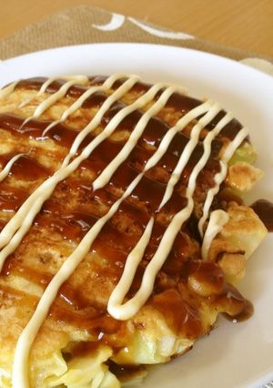 A picture of A Single Serving Okonomiyaki with Just Cabbage.