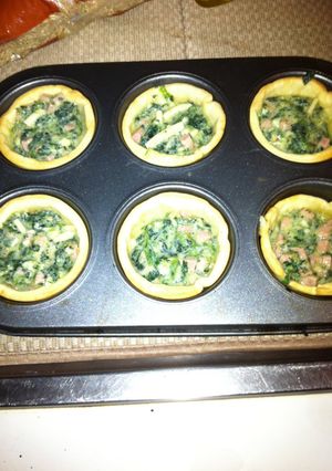 A picture of Mini Spinach And Ricotta Quiches.