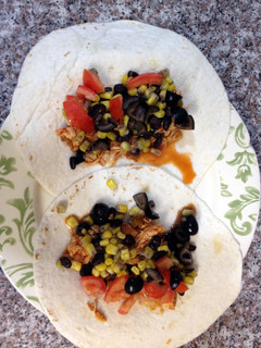 A picture of Salsa shredded chicken tacos.