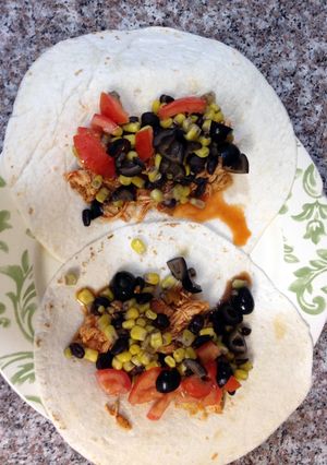 A picture of Salsa shredded chicken tacos.