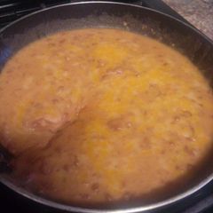 A picture of Mexican style bacon cheese refried beans.