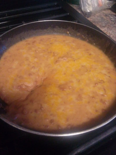 A picture of Mexican style bacon cheese refried beans.