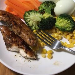 Fried chicken breast on boiled veggies A picture of Fried chicken breast on boiled veggies.