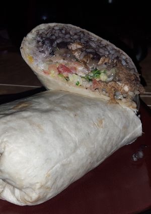 A picture of Grilled chicken and braised pork burrito.