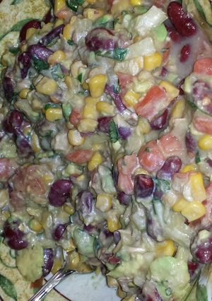 A picture of tuna , beans , corn salad.