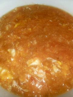 A picture of Baked bean soup with egg.