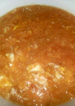 A picture of Baked bean soup with egg.