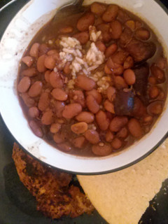 A picture of Spicy brown beans with smoked meat.