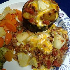 A picture of Stuffed eggplant with the trimmings.