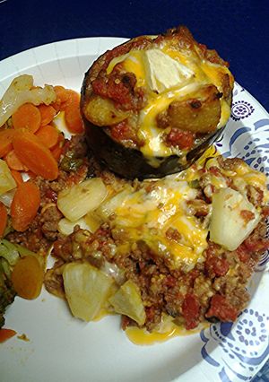 A picture of Stuffed eggplant with the trimmings.