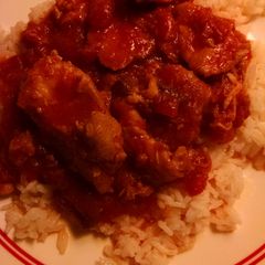 A picture of Chicken with bacon tomato sauce.