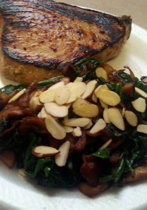 A picture of Paleo Seared tuna with citrus marinade and sauted spinach with mushrooms, onions, and bacon.