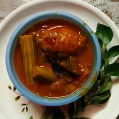 A picture of Drumsticks & tomato curry.