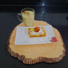 A picture of Baked khakhra sandwich with almond milkshake.