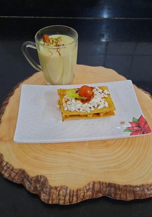 A picture of Baked khakhra sandwich with almond milkshake.