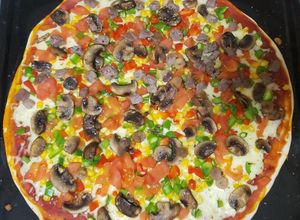 Una foto de Pizza casi vegetariana