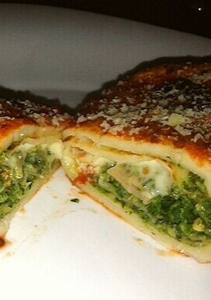 Una foto de Canelones de espinaca, jamón, queso y avena