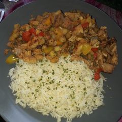 A picture of Apple and pear chicken tikka stir fry with rice.
