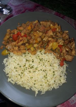 A picture of Apple and pear chicken tikka stir fry with rice.