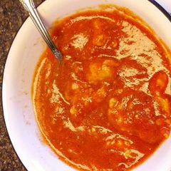 A picture of Tomato Basil Soup with Ricotta Dumplings.