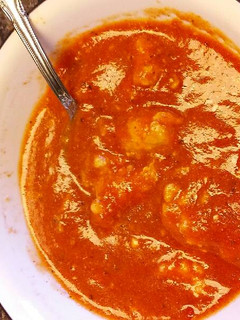 A picture of Tomato Basil Soup with Ricotta Dumplings.