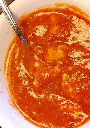 A picture of Tomato Basil Soup with Ricotta Dumplings.