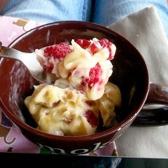 Banana ice cream with frozen raspberries A picture of Banana ice cream with frozen raspberries.