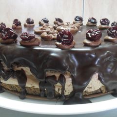 A picture of Chocolate Mousse Cake with Cherries.
