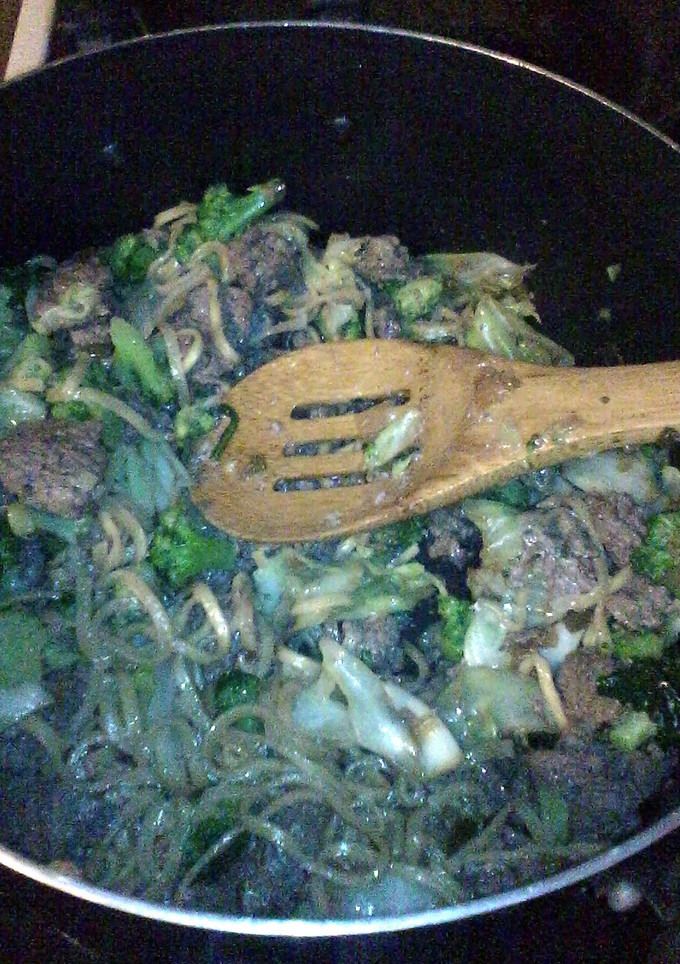 A picture of beef with lomein noodles.